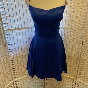 Elegant Blue Spaghetti Strap Dress with lace up back closure design and pockets